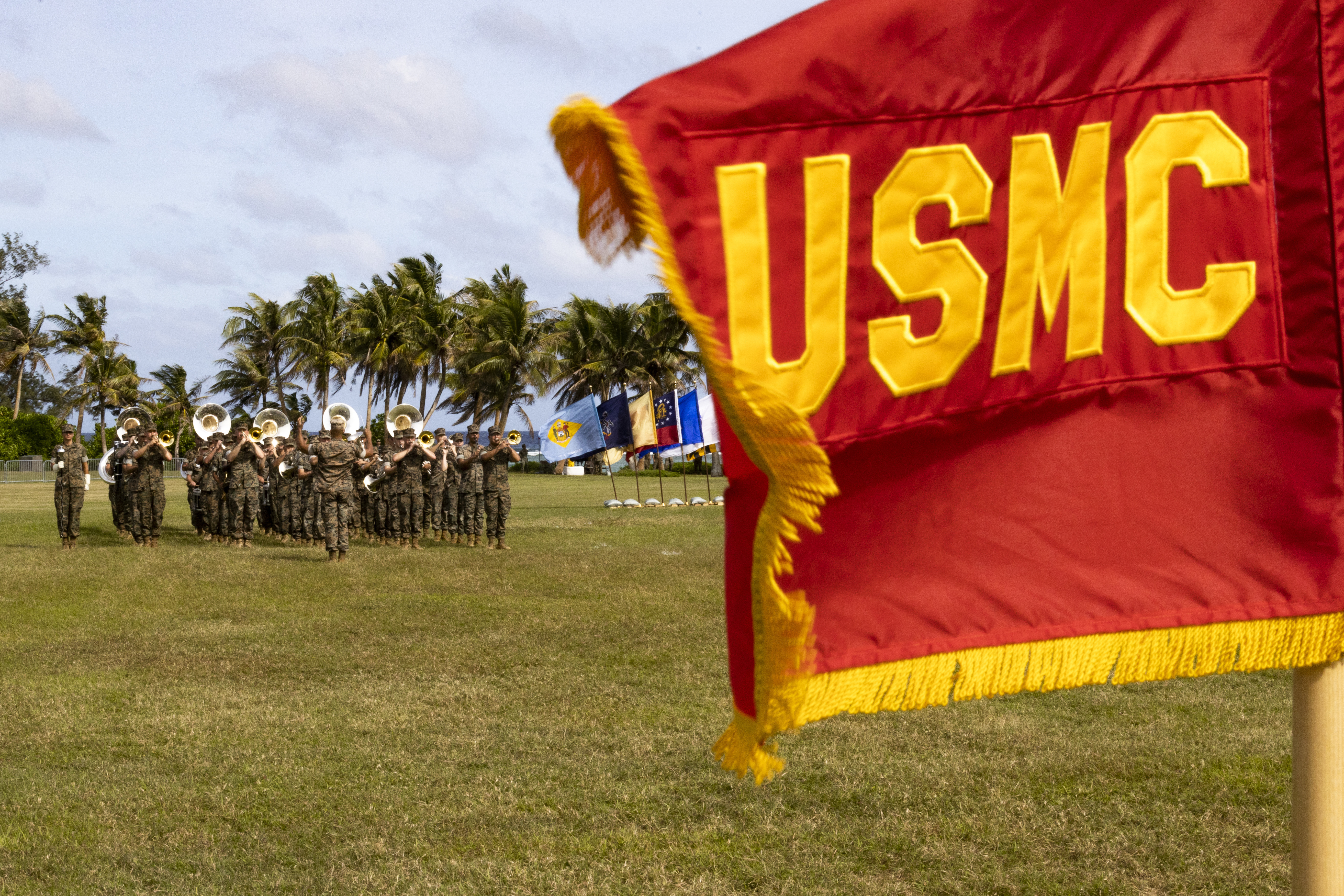 U.S. Marines with Marine Forces Pacific Band march during the Marine Corps Base Camp Blaz Reactivation and Naming Ceremony at Asan Beach, National Historical Park, Asan, Guam, on Jan. 26, 2023. The ceremony officially recognized the activation and naming of Naval Support Activity, MCB Camp Blaz after Marine Barracks Guam was deactivated on Nov. 10, 1992. MCB Camp Blaz was administratively activated on Oct. 1, 2020. It is the first newly constructed base for the Marine Corps since 1952 and will serve as an enduring symbol of the continued partnership between the Marine Corps and the Government of Guam, which has existed since the Spanish surrender to U.S. forces on June 21, 1898. (U.S. Marine Corps photo by Lance Cpl. Jonathan Beauchamp)