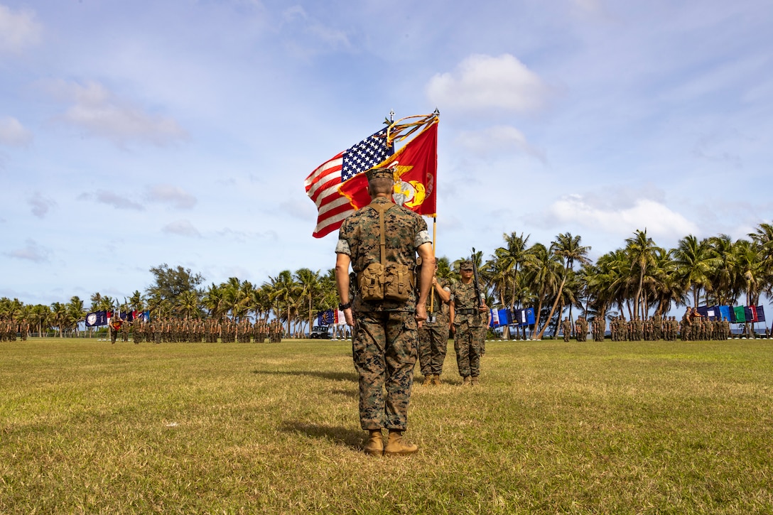 U.S. Marines stand at attention during the Marine Corps Base Camp Blaz Reactivation and Naming Ceremony at Asan Beach, National Historical Park, Asan, Guam, on Jan. 26, 2023. The ceremony officially recognized the activation and naming of Naval Support Activity, MCB Camp Blaz after Marine Barracks Guam was deactivated on Nov. 10, 1992. MCB Camp Blaz was administratively activated on Oct. 1, 2020. It is the first newly constructed base for the Marine Corps since 1952 and will serve as an enduring symbol of the continued partnership between the Marine Corps and the Government of Guam, which has existed since the Spanish surrender to U.S. forces on June 21, 1898. (U.S. Marine Corps photo by Lance Cpl. Jonathan Beauchamp)