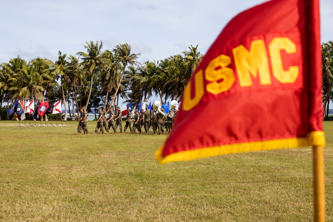 U.S. Marines with Marine Forces Pacific Band march during the Marine Corps Base Camp Blaz Reactivation and Naming Ceremony at Asan Beach, National Historical Park, Asan, Guam, on Jan. 26, 2023. The ceremony officially recognized the activation and naming of Naval Support Activity, MCB Camp Blaz after Marine Barracks Guam was deactivated on Nov. 10, 1992. MCB Camp Blaz was administratively activated on Oct. 1, 2020. It is the first newly constructed base for the Marine Corps since 1952 and will serve as an enduring symbol of the continued partnership between the Marine Corps and the Government of Guam, which has existed since the Spanish surrender to U.S. forces on June 21, 1898. (U.S. Marine Corps photo by Lance Cpl. Jonathan Beauchamp)