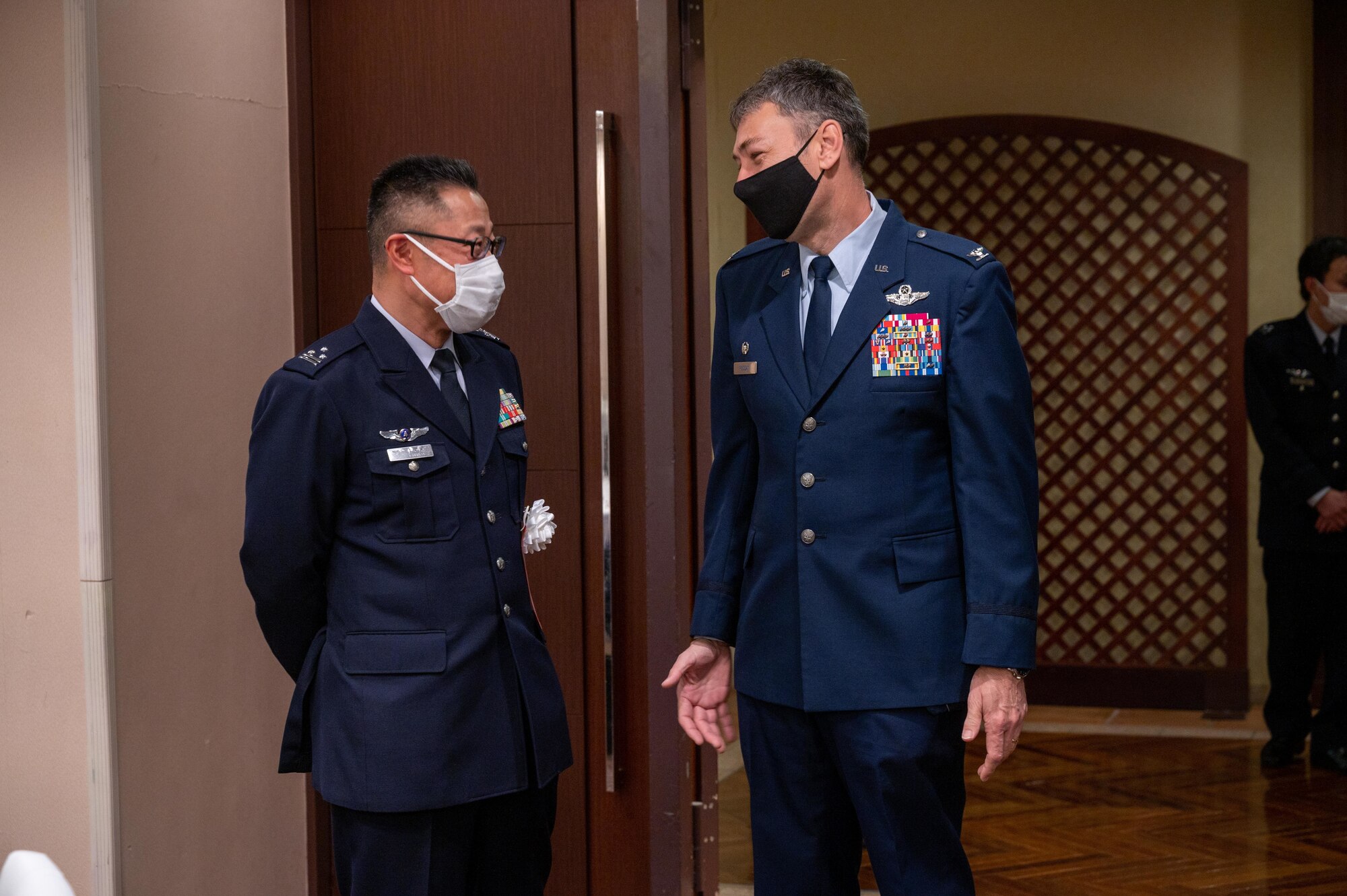 Col. Roddan speaks with Col. Takashi Izuhara.