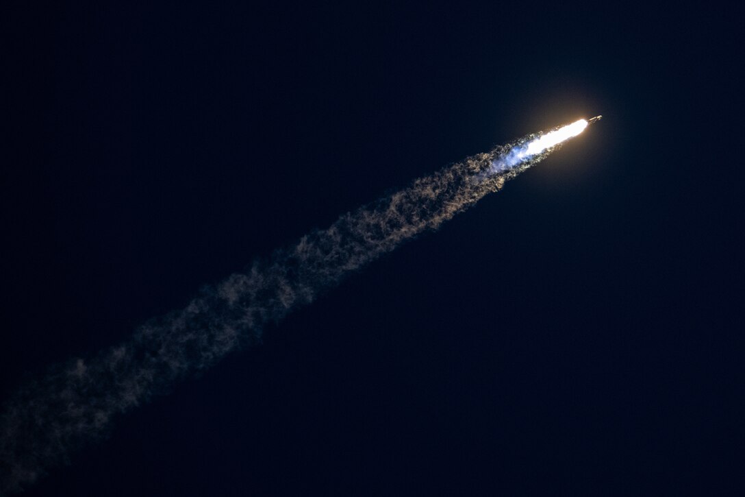 A rocket soars into space.