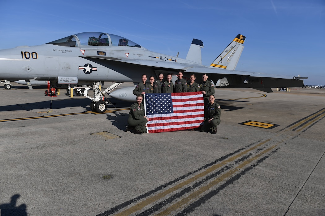 Naval aviators participating in a flyover to honor the life and legacy of retired Navy Capt. Rosemary Mariner pose for a photo at Naval Air Station Oceana in Virginia Beach, Virginia Feb. 2, 2019.