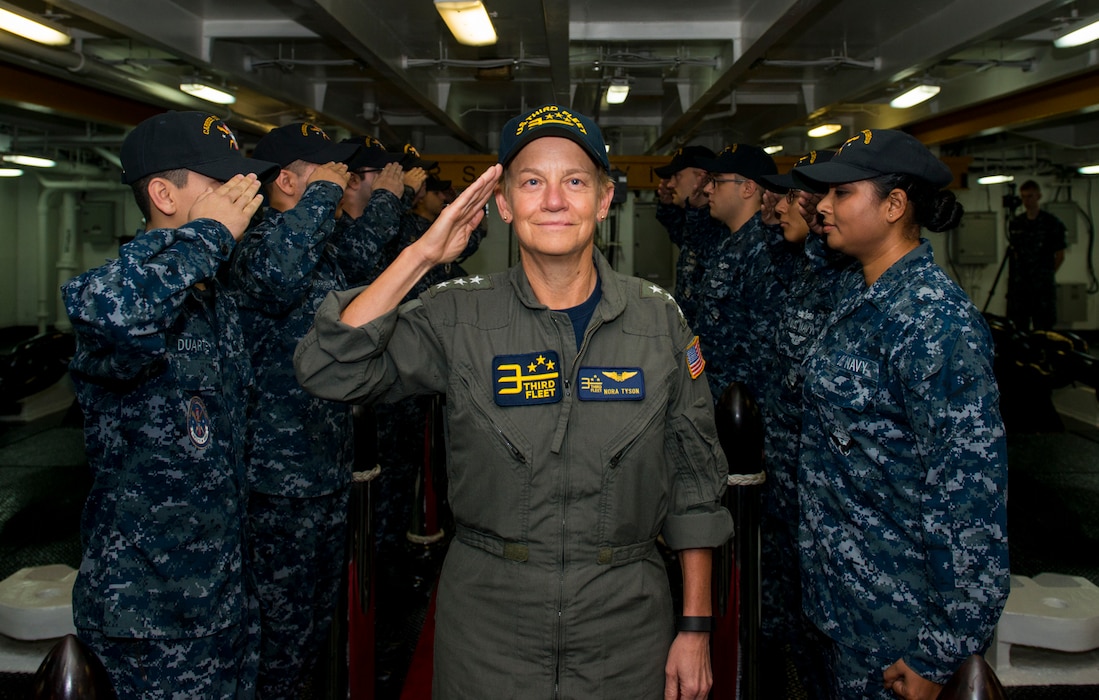 Vice Adm. Nora Tyson, Commander, U.S. 3rd Fleet, renders a salute as she receives side honors aboard the aircraft carrier USS Carl Vinson (CVN 70) during the Carrier Strike Group One (CSG-1) change of command ceremony