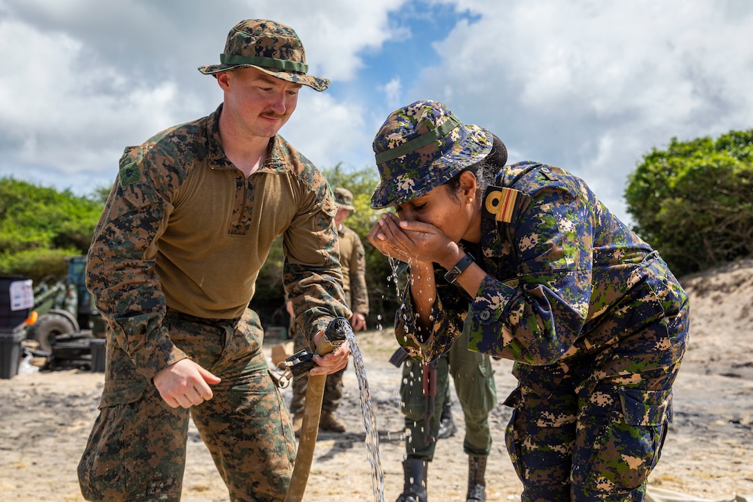 U.S. Marine Corps Cpl. Gage Wesley, a water support technician with Combat Logistics Battalion 13, 13th Marine Expeditionary Unit, gives a Sri Lanka Navy medical officer a sample of fresh water from a lightweight water purification system during a Humanitarian Assistance and Disaster Relief exercise, Jan. 23, in Mullikulam. CARAT/MAREX Sri Lanka is a bilateral exercise between Sri Lanka and the United States designed to promote regional security cooperation, practice humanitarian assistance and disaster relief, and strengthen maritime understanding, partnerships, and interoperability. In its 28th year, the CARAT series is comprised of multinational exercises, designed to enhance U.S. and partner forces’ abilities to operate together in response to traditional and non-traditional maritime security challenges in the Indo-Pacific region.
