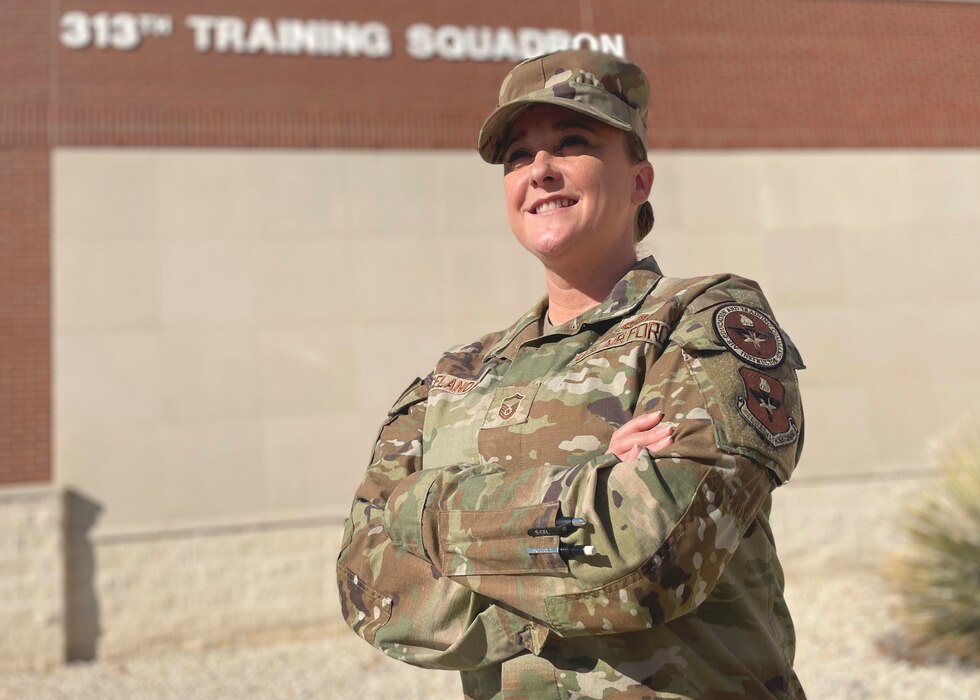 U.S. Air Force Senior Master Sgt. Heather Celano, 313th Training Squadron senior enlisted leader, stands outside her squadron, Goodfellow Air Force Base, Texas, January 11, 2023. Celano served 18.5 years, eight of which as a single parent, and achieved the highest enlisted rank, Chief Master Sgt., on Dec. 6, 2022. (U.S. Air Force photo by Senior Airman Abbey Rieves)