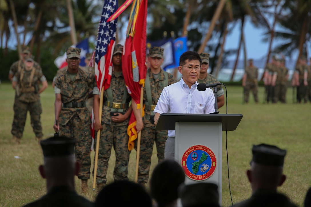 Mr. Kimura Jiro, Parliamentary Vice-Minister of Defense from the Government of Japan, speaks at the Marine Corps Base (MCB) Camp Blaz Reactivation and Naming Ceremony at Asan Beach, Guam, Jan. 26, 2023. The Reactivation and Naming Ceremony officially recognized the activation and naming of Naval Support Activity, MCB Camp Blaz after Marine Barracks Guam was deactivated on Nov. 10, 1992. The future relocation of forces to Guam honors the Defense Policy Review Initiative, an international agreement with the Government of Japan, and it secures a Marine Corps posture in the Indo-Pacific region that is geographically distributed, operationally resilient and politically sustainable. (U.S. Marine Corps photo by Lance Cpl. Garrett Gillespie)