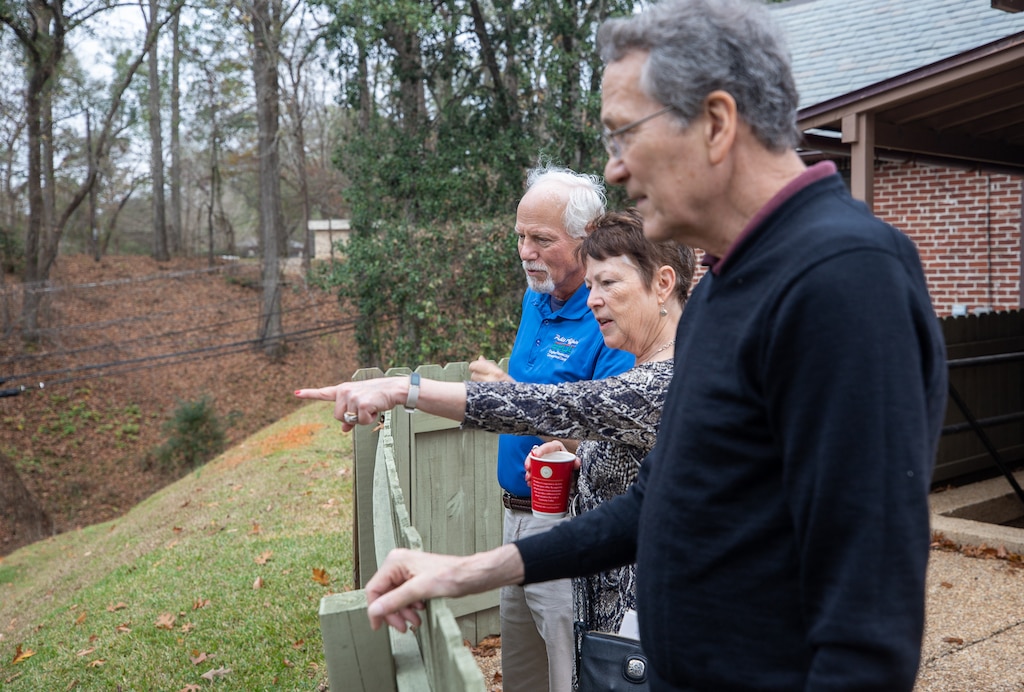 Terry Winschel, historian at the U.S. Army Engineer Research and Development Center (ERDC), gives a tour of the ERDC-Vicksburg site to Susan Vogel Wilson and her husband, Bruce Wilson. Wilson is the granddaughter of the late Lt. Herbert Vogel, who served as the first commander of the Waterways Experiment Station