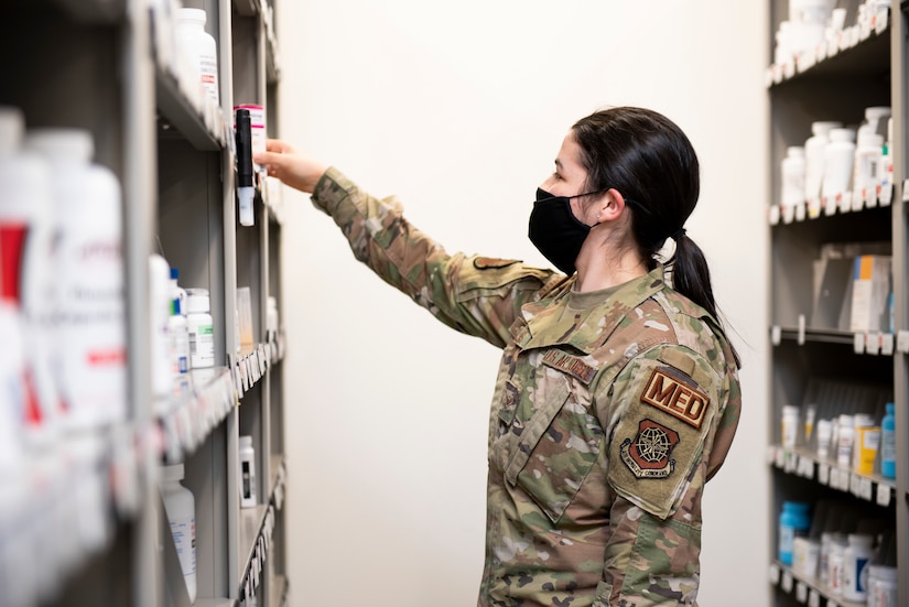 Airman looks for medication.