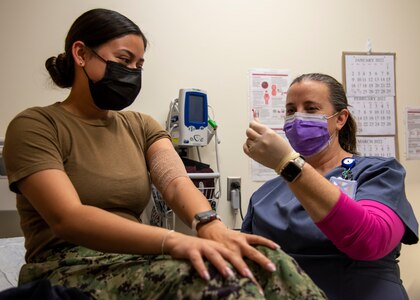 Nurse assists patient.
