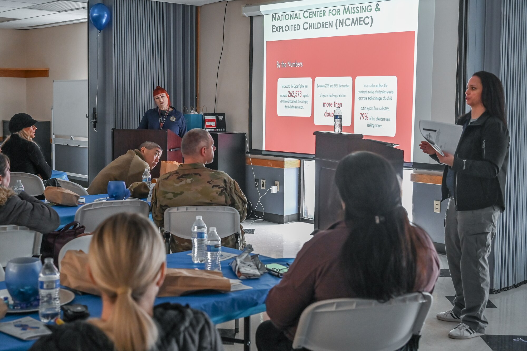 Special Agent Sarah Lundquist (right) and education specialist Michelle Busch-Upwall (left), both assigned to the Internet Crimes Against Children Task Force with the Utah Attorney General’s Office, speak at the Sexual Assault Prevention & Response Combating Trafficking in Persons event Jan. 24, 2023, at Hill Air Force Base, Utah.