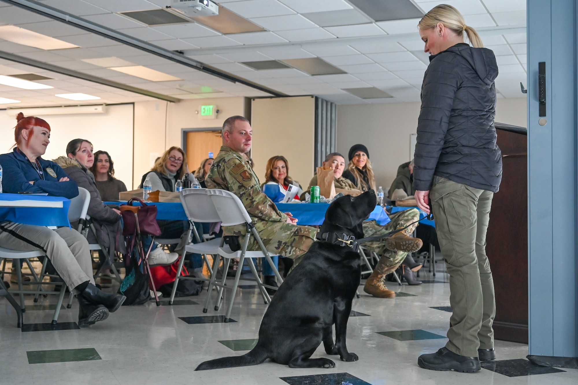 Detective Kimberly Burton, Woods Cross Police Department, and her partner, K-9 Flash, demonstrate their abilities at the Sexual Assault Prevention & Response Combating Trafficking in Persons event Jan. 24, 2023, at Hill Air Force Base, Utah.