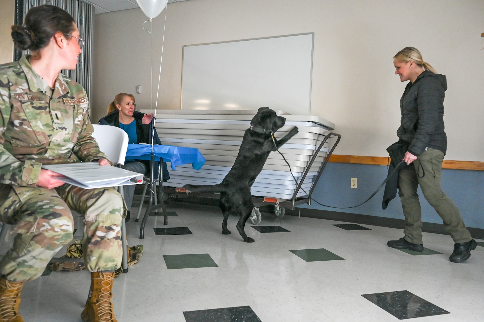 Detective Kimberly Burton, Woods Cross Police Department, and her partner, K-9 Flash, demonstrate their abilities at the Sexual Assault Prevention & Response Combating Trafficking in Persons event Jan. 24, 2023, at Hill Air Force Base, Utah