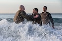 U.S. Marine Corps 1st Lt. Craig Stieff, left, a ground intelligence officer with 1st Intelligence Battalion, I Marine Expeditionary Force Information Group, performs shallow water grappling with U.S. Marine Corps Cpl. Melvin Sorto, an aircraft intermediate-level hydraulic and pneumatic mechanic with Marine Aviation Logistics Squadron 39, Marine Aircraft Group 39, 3rd Marine Aircraft Wing, during a martial arts instructor course culminating event at Marine Corps Base Camp Pendleton, California, Dec. 15, 2022. MAI courses certify Marines to instruct and monitor Marine Corps Martial Arts Program training and advance Marines in the program, distinguishing their levels of experience with different colored belts. (U.S. Marine Corps photo by Lance Cpl. Gadiel Zaragoza)