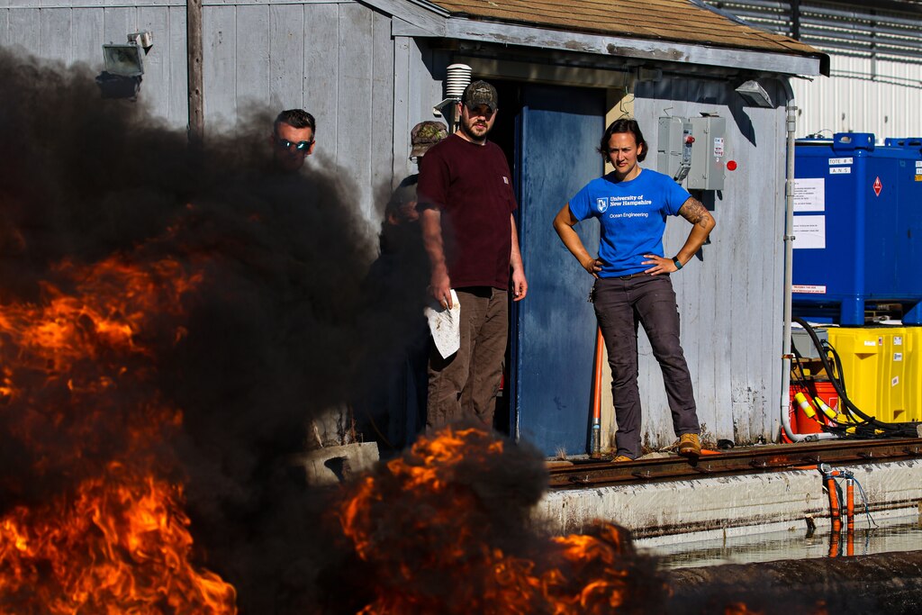 Kate Trubac, a Cold Regions Research and Engineering Laboratory research general engineer, oversees an in-situ burn experiment conducted with the Bureau of Safety and Environmental Enforcement. The burns are testing the efficiency of a new system designed to improve oil spill clean up.