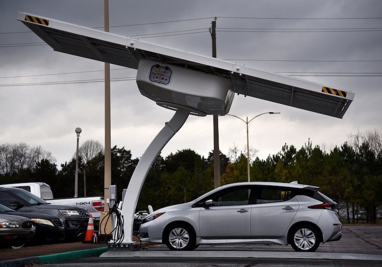 An electric vehicle charges its battery at one of the seven solar-powered charging stations recently installed at Redstone Arsenal, Alabama. The U.S. Army Engineering and Support Center, Huntsville awarded contracts and are providing technical oversight for nearly 500 of these stations at Army installations as part of the service's initiative to transition to a fully electric vehicle fleet by 2050. (Photo by Chris Putman)