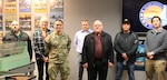 A group of individuals face the camera. They were part of a visit by DCMA personnel to the Navy facility in Groton, Conn.
