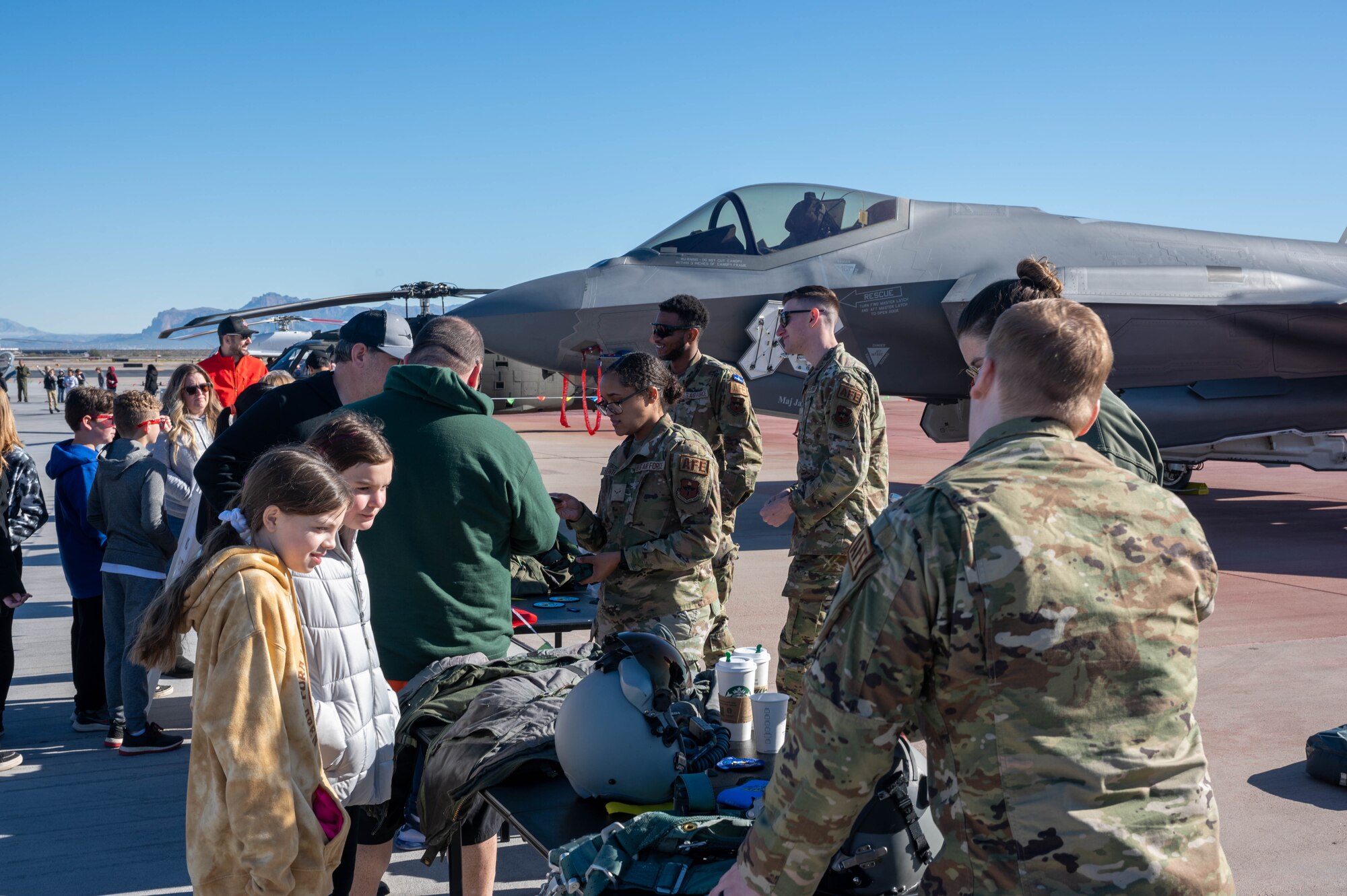 Airmen from the 56th Fighter Wing, assigned to Luke Air Force Base, Arizona, showcase pilot flight equipment at the Mesa Gateway Aviation Day, Jan. 24, 2023, in Mesa, Arizona.