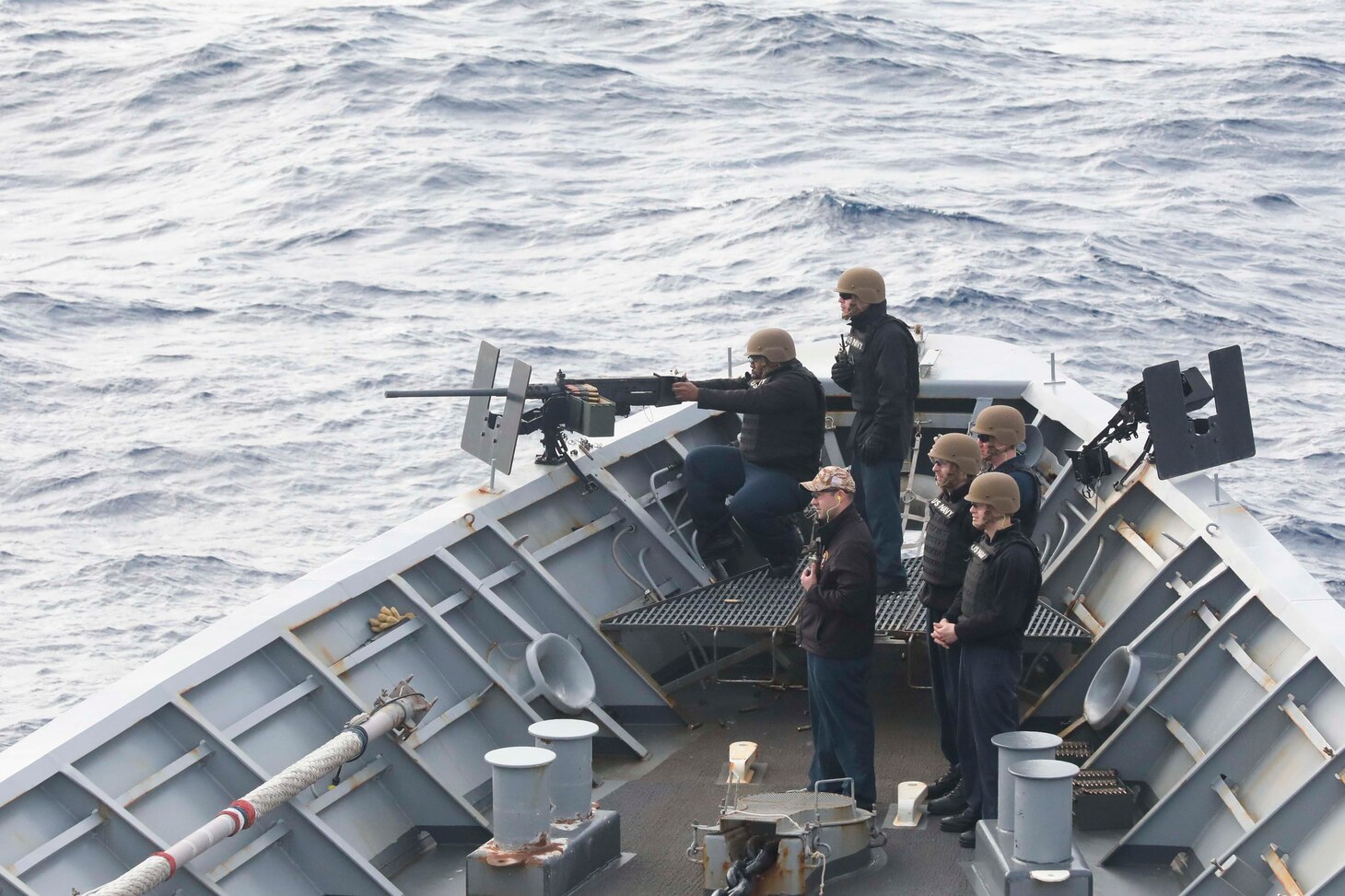 Sailors fire the M2 .50 caliber machine gun aboard the Ticonderoga-class guided-missile cruiser USS Chancellorsville (CG 62), during a live fire exercise, in the Philippine Sea, Jan 20. Chancellorsville is assigned to Commander, Task Force 70/Carrier Strike Group 5 underway preforming routine operations in support of a free and open Indo-Pacific.