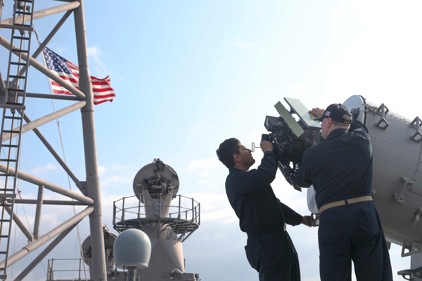 Fire Controlman 2nd Class Francisco Morales, from Long Beach, California, left, and Chief Fire Controlman Wayne Whalen, from San Diego, California, work on the Phalanx close-in weapons system (CIWS) aboard the Ticonderoga-class guided-missile cruiser USS Chancellorsville (CG 62) in the Philippine Sea, Jan. 20. Chancellorsville is assigned to Commander, Task Force 70/Carrier Strike Group 5 underway preforming routine operations in support of a free and open Indo-Pacific.