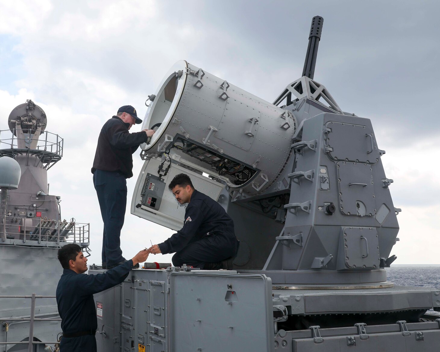 From left to right, Fire Controlman 2nd Class Francisco Morales, from Long Beach, California, Chief Fire Controlman Wayne Whalen, from San Diego, and Fire Controlman 2nd Class James Yates, from Rome, New York, work on the Phalanx close-in weapons system (CIWS) aboard the Ticonderoga-class guided-missile cruiser USS Chancellorsville (CG 62) in the Philippine Sea, Jan. 20. Chancellorsville is assigned to Commander, Task Force 70/Carrier Strike Group 5 underway preforming routine operations in support of a free and open Indo-Pacific.