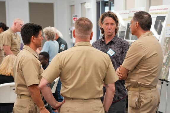 During an Environmental Protection Agency (EPA) hosted open house, Joint Task Force-Red Hill (JTF-RH) personnel speak with a member of the EPA at the Oahu Veterans Council and Center in Honolulu, Hawaii, Jan. 19, 2023.
