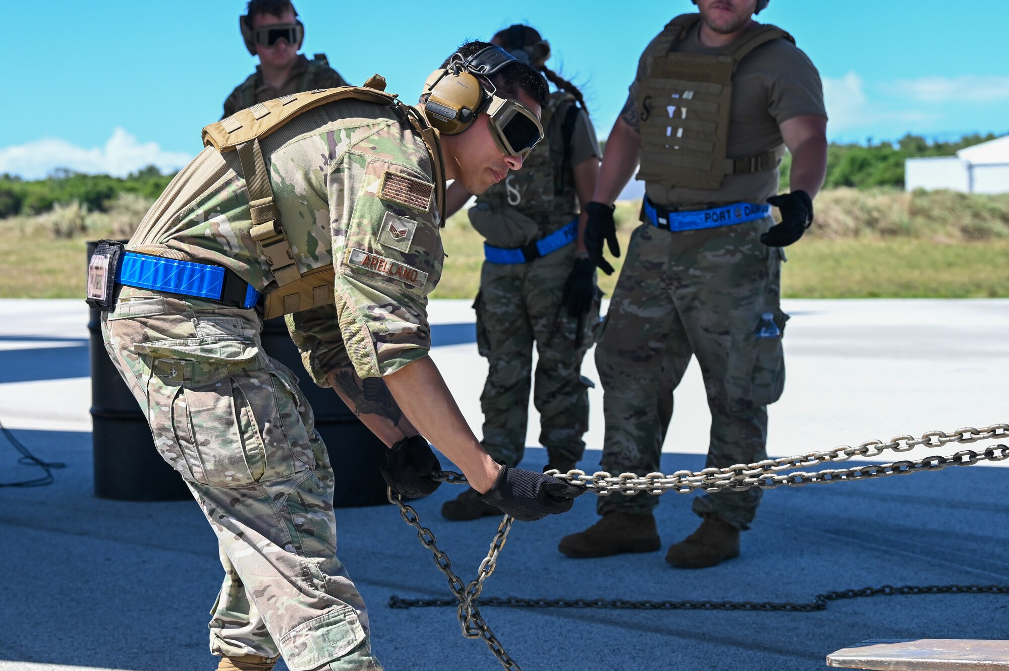 U.S. Air Force Senior Airman Edgar Arellano, an information controller with the 734th Air Mobility Squadron, begins unloading a U.S. Air Force C-130J Super Hercules on Pacific Air Forces Regional Training Center-Andersen Air Force Base, Guam, Jan. 20, 2023. The 734th AMS split into small teams and performed rolling offloads of cargo during a Field Training Exercise. (U.S. Air Force photo by Airman 1st Class Allison Martin)