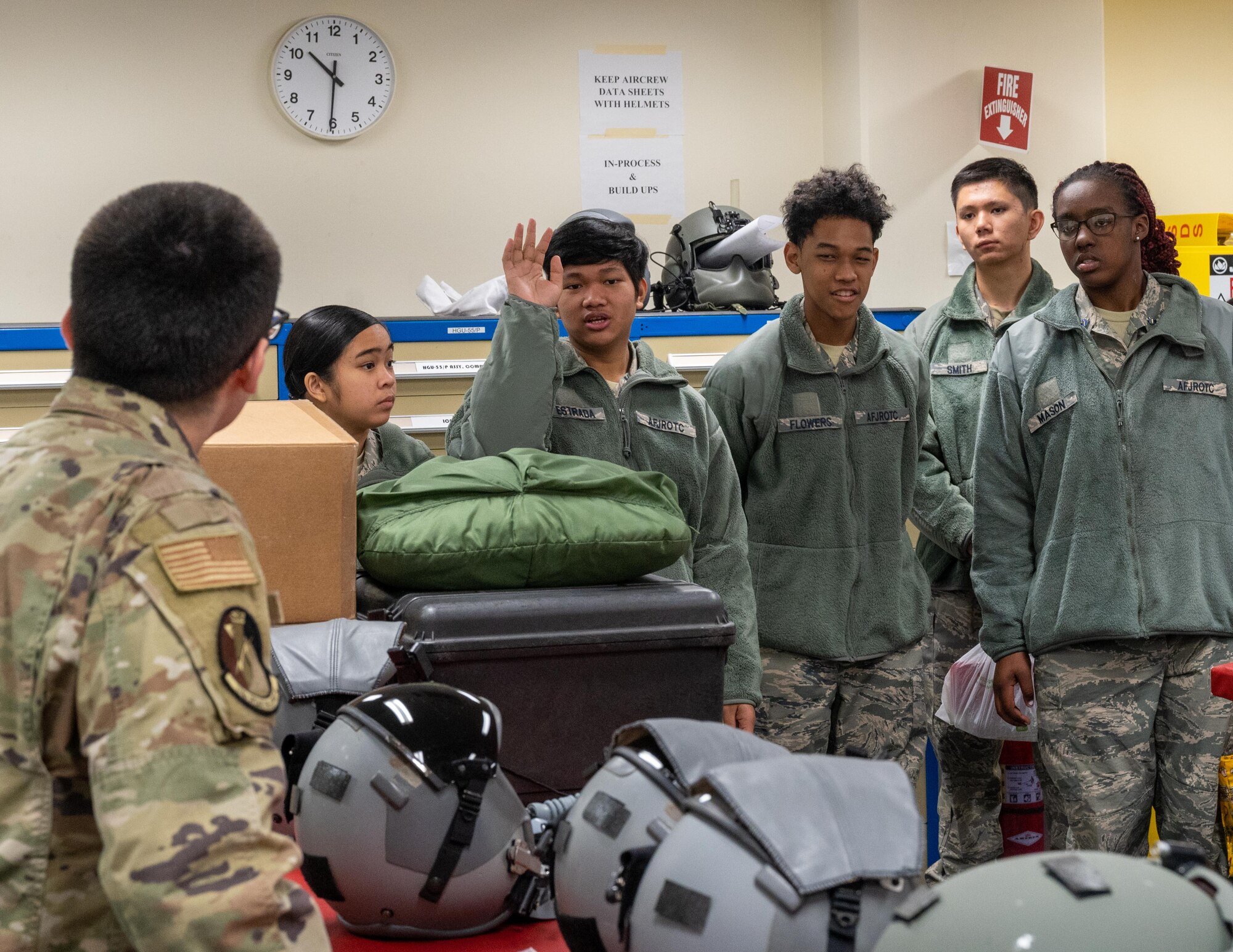 A student from Yokota High School raises his hand to ask a question