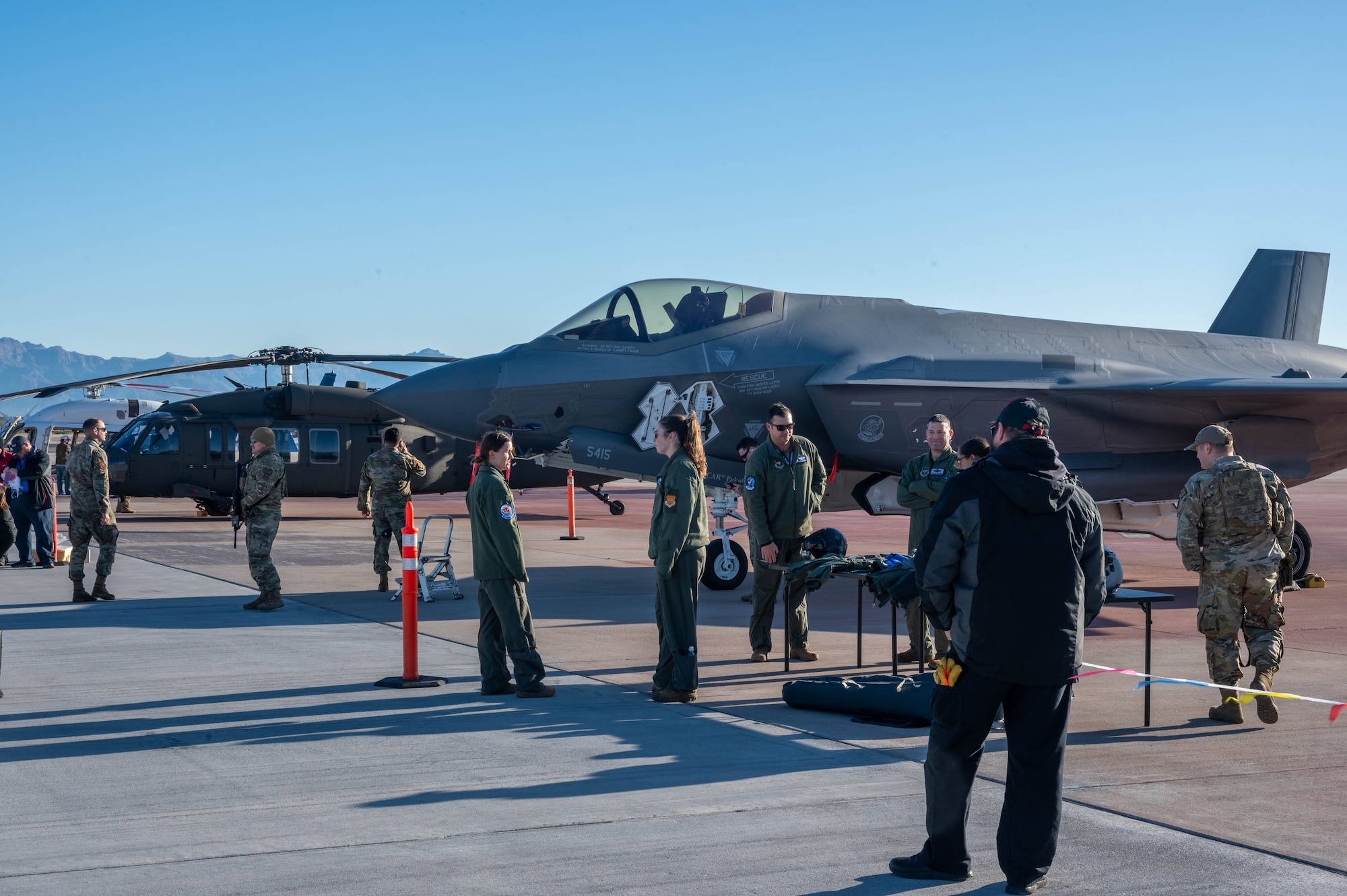 Airmen assigned to the 56th Fighter Wing at Luke Air Force Base, Arizona, showcase an F-35 Lightning II aircraft during the Mesa Gateway Aviation Day, Jan. 24, 2023, in Mesa, Arizona.