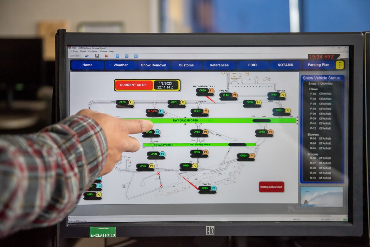 Rome Alcantara, 88th Operations Support Squadron airfield manager, inputs data into the digital airfield map at Wright-Patterson Air Force Base, Ohio, Jan. 10, 2023. Each runway and taxiway are broken into individual sections, and Alcantara can select whether it’s open, closed or suspended. That information is then uploaded to a website where pilots, air traffic controllers and base leadership can see real-time data on flightline conditions. (U.S. Air Force photo by Matthew Clouse)