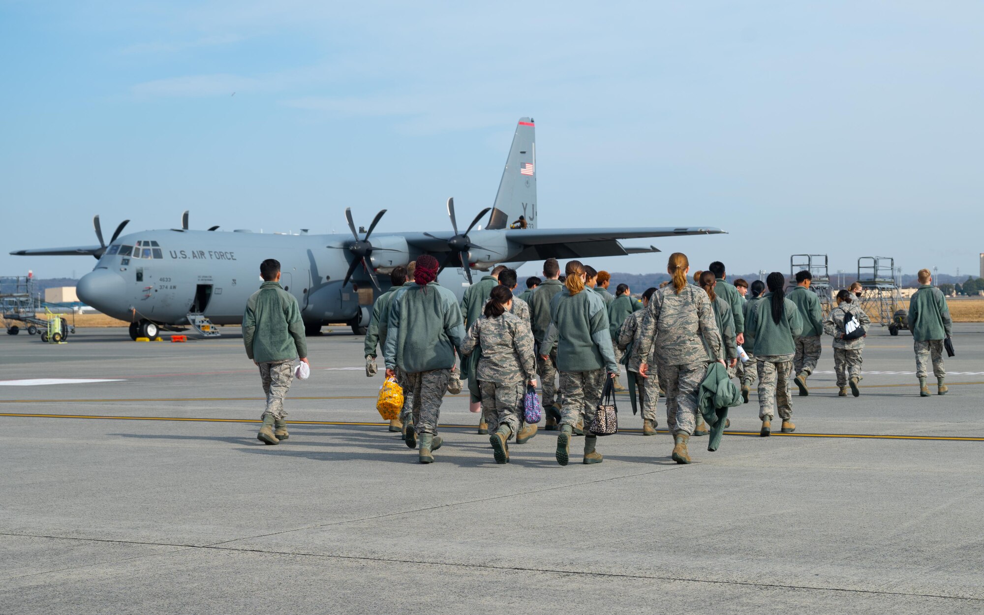 Students walk across the flight-line