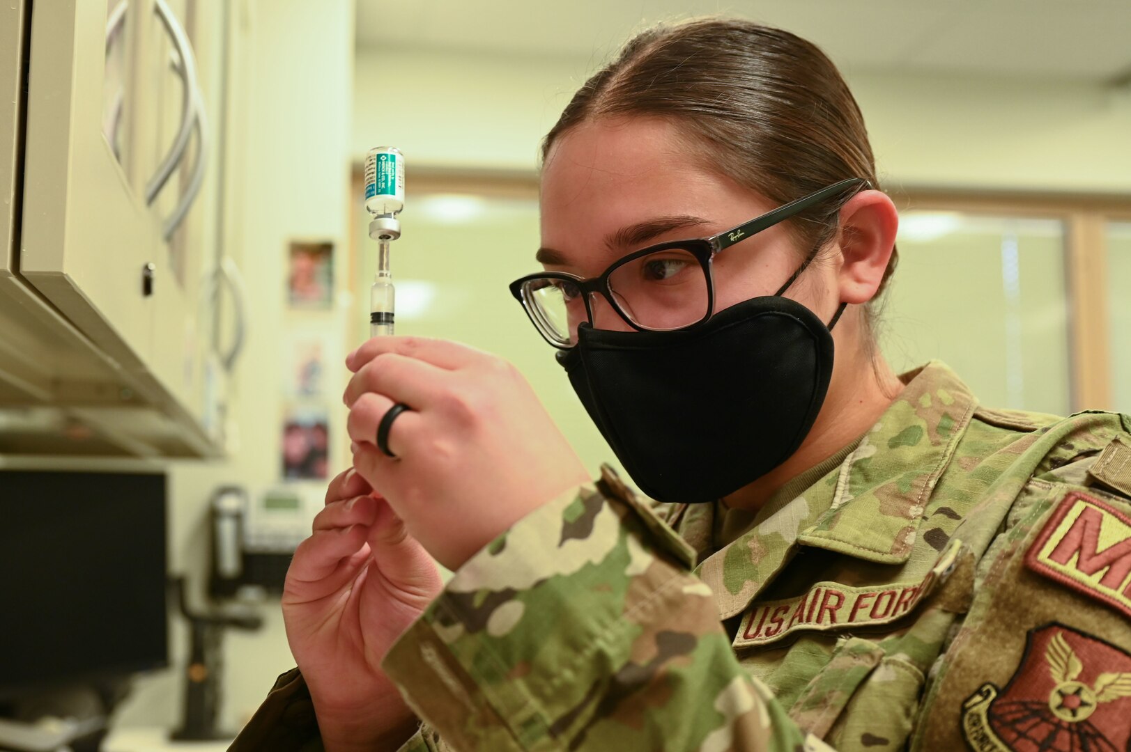 Airman prepares medication.