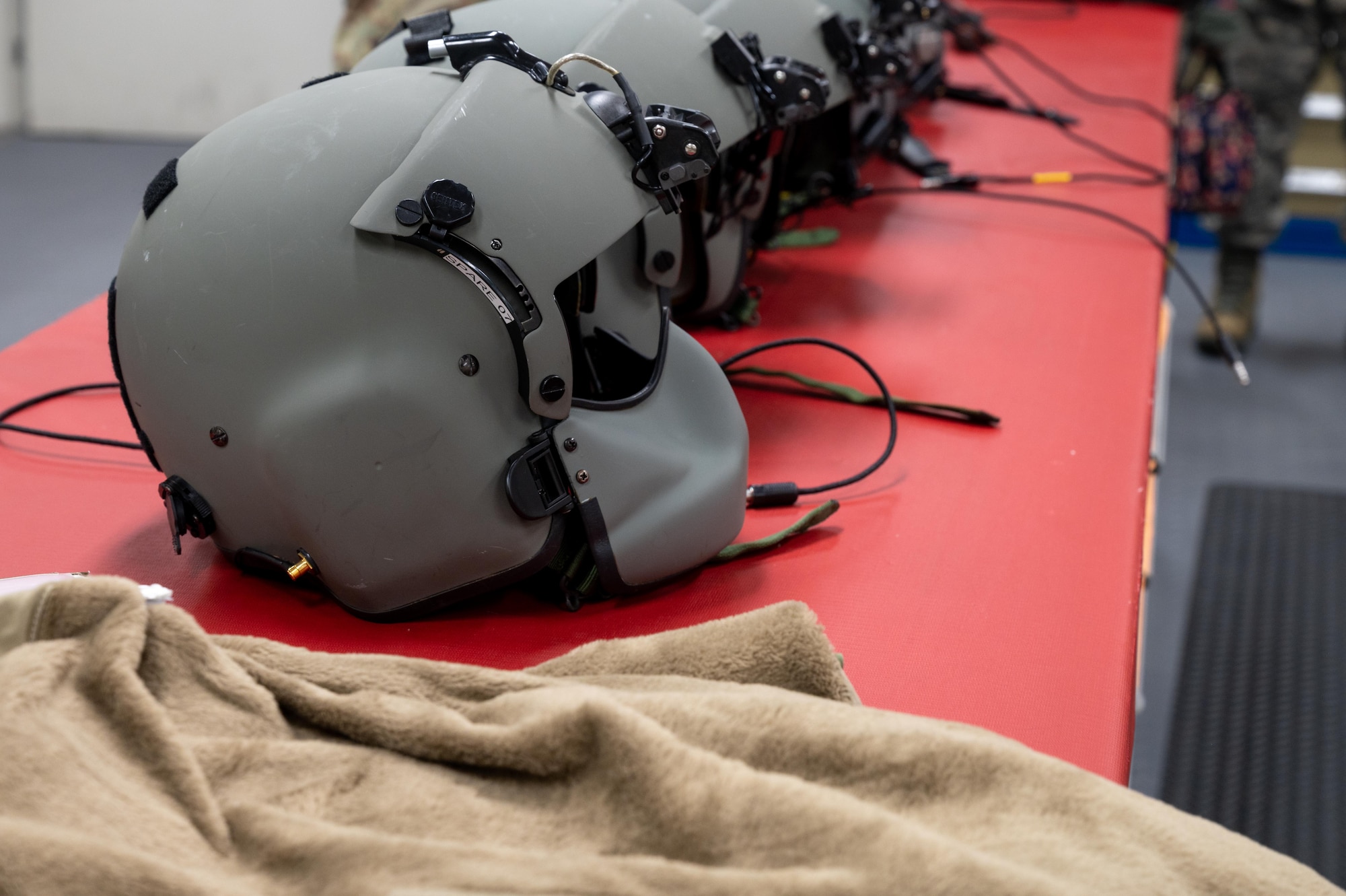 A aircrew helmet sits on display