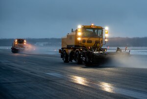 A heavy-equipment operator from the 88th Civil Engineer Group’s snow-removal team uses a brush to clear the runway at Wright-Patterson Air Force Base, Ohio, Jan. 25, 2023. The team is responsible for clearing more than 18 million square feet of concrete to keep the airfield open. (U.S. Air Force photo by Matthew Clouse)