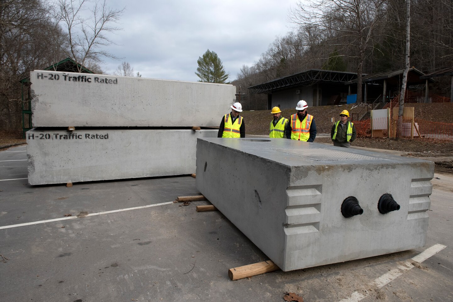 U.S. Army Corps of Engineers Nashville District and National Park Service officials look at a new septic system Jan. 20, 2023, prior to its installation. Construction for a wastewater project is underway to provide a sanitary upgrade for the National Park Service Blue Heron Mine at the Big South Fork National River and Recreation Area in Stearns, Kentucky. (USACE Photo by Lee Roberts)