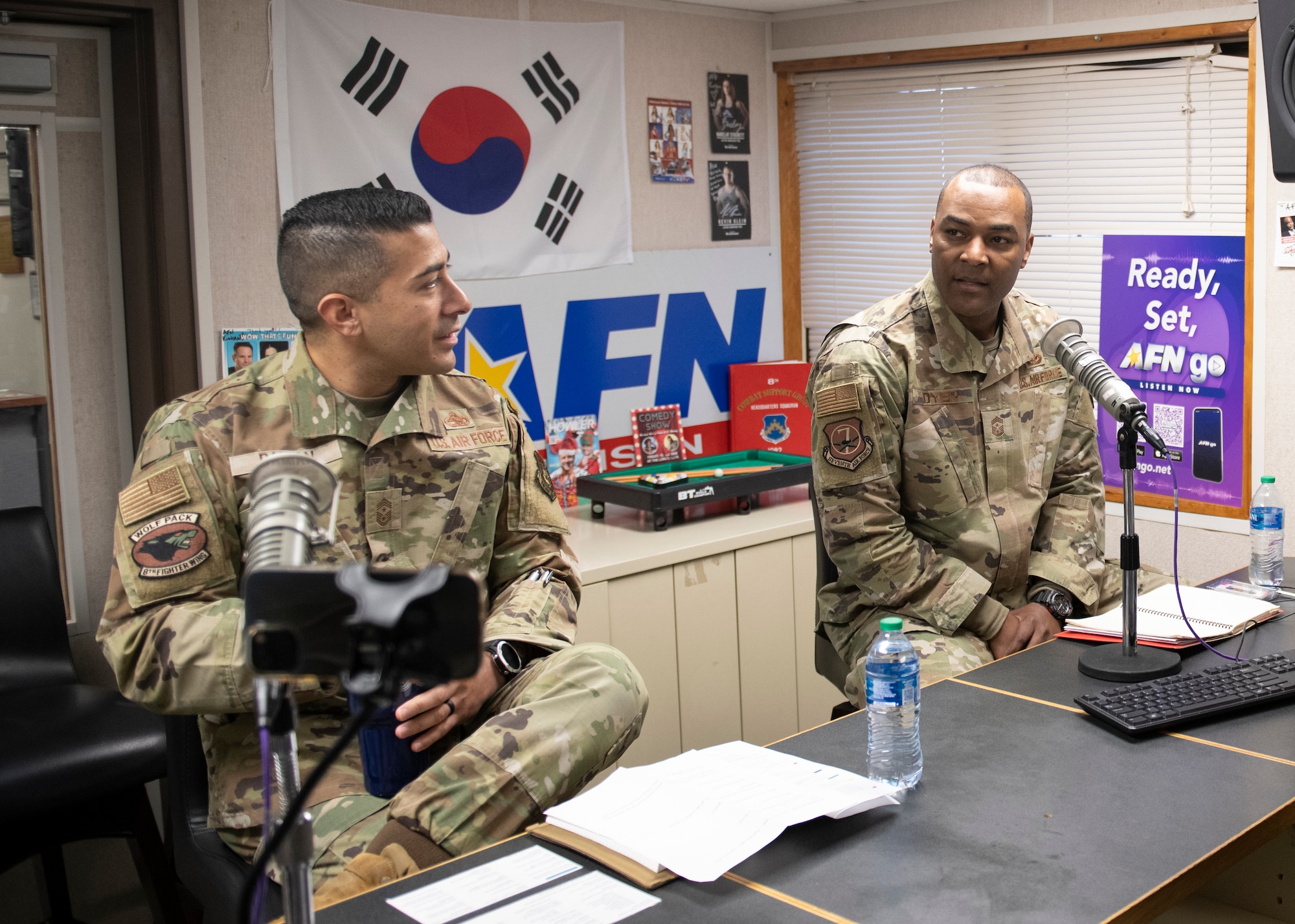 U.S. Air Force Chief Master Sgts. Alvin R. Dyer (right), 7th Air Force command chief, and Carlos “Wolf Chief” Damian (left), 8th Fighter Wing command chief, host a “Howl at the Wolf Chief” Armed Forces Network radio show at Kunsan Air Base, Republic of Korea, Jan. 26, 2023. Seventh AF leadership visited Kunsan AB to refamiliarize with many of the mission sets that support a free and open Indo-Pacific region. (U.S. Air Force photo by Staff Sgt. Isaiah J. Soliz)