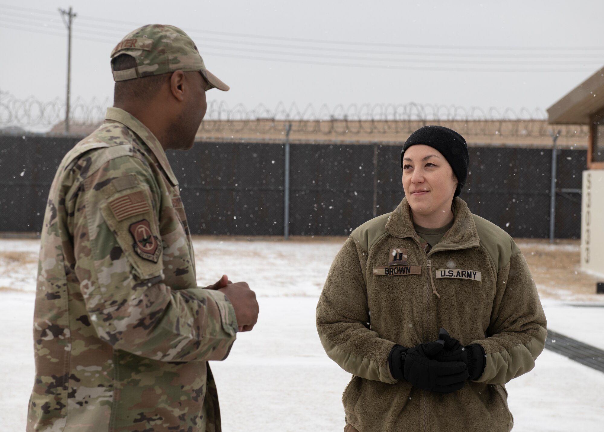 U.S. Air Force Chief Master Sgt. Alvin R. Dyer (left), 7th Air Force command chief, receives an Air Defense Artillery informational briefing from U.S. Army Capt. Sarah Brown (right) Alpha Battery 2-1 commander, at Kunsan Air Base, Republic of Korea, Jan. 26, 2023. Seventh AF leadership had the opportunity to learn how the ADA reinforces the unified security of the Korean peninsula. (U.S. Air Force photo by Staff Sgt. Isaiah J. Soliz)