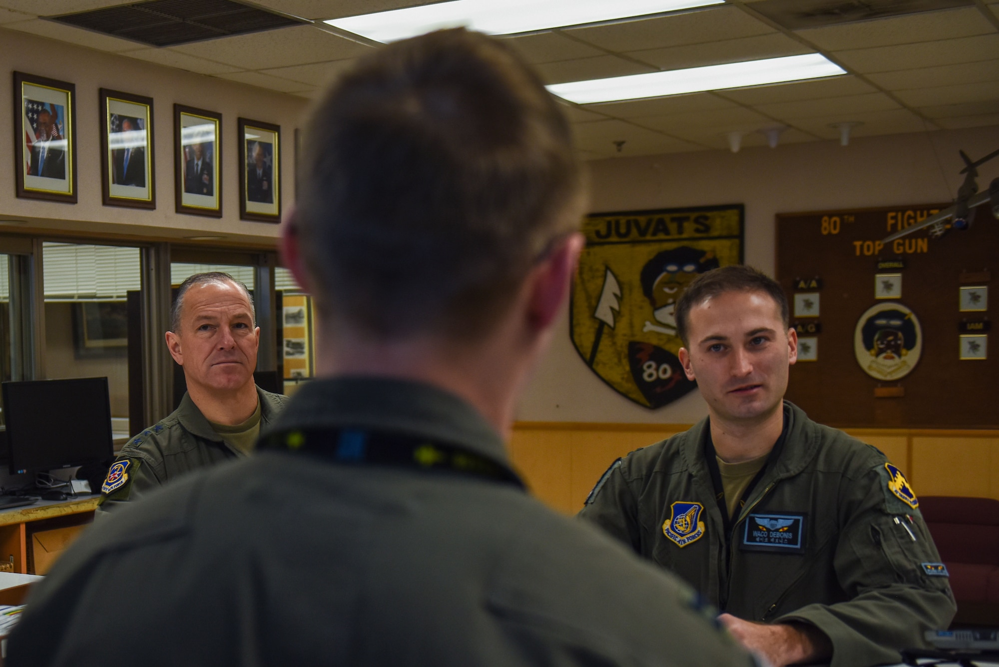 U.S. Air Force Lt. Gen. Scott “Rolls” Pleus (left), 7th Air Force commander and Capt. Nicholas “Waco” Debonis, 35th Fighter Squadron pilot (right) receives a mission brief prior to a sortie at Kunsan Air Base, Republic of Korea, Jan. 26, 2023. Gen. Pleus is a command pilot with more than 2,500 flight hours in airframes to include the F-16 Fighting Falcon. (U.S. Air Force photo by Tech. Sgt. Timothy Dischinat)