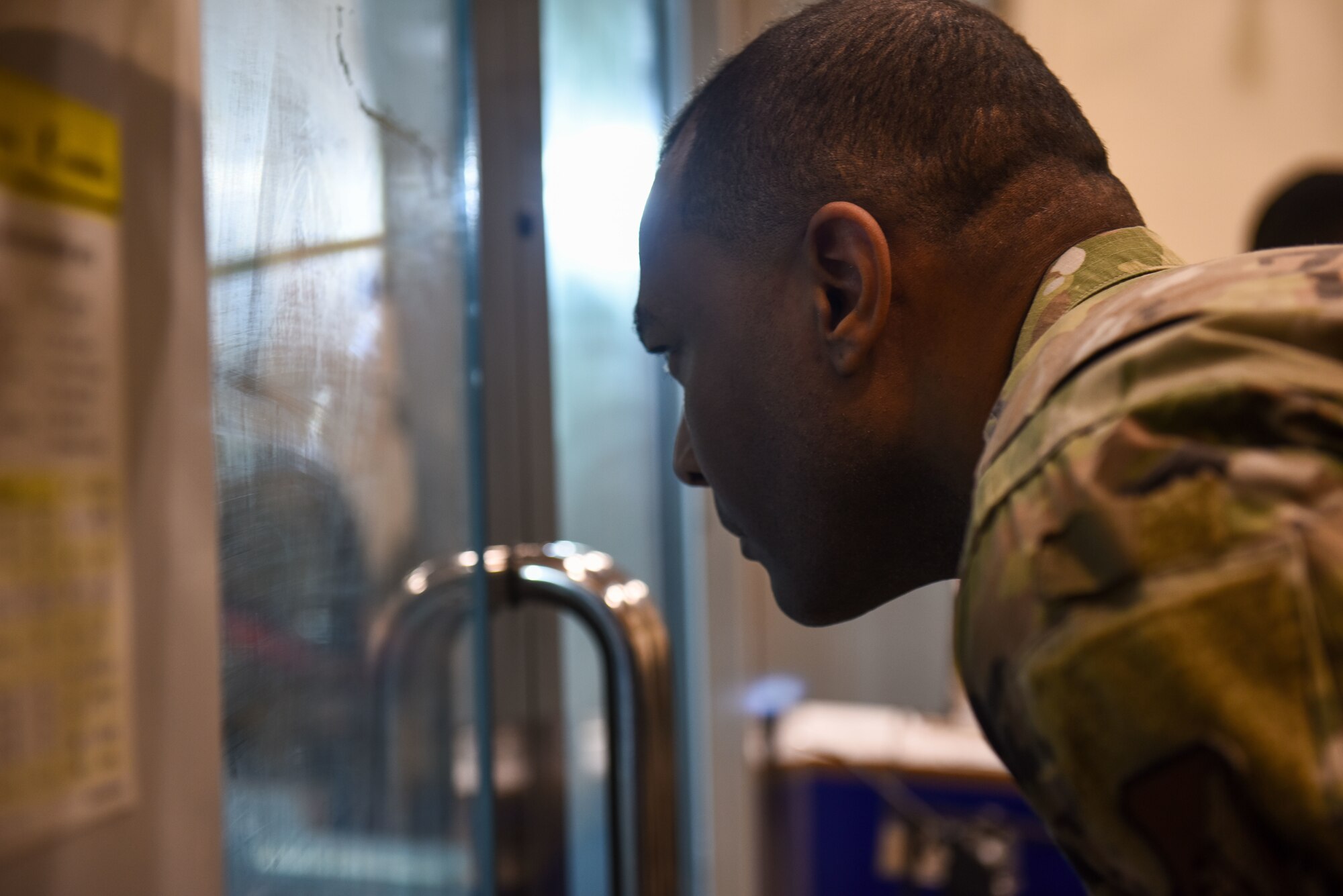 U.S. Air Force Chief Master Sgt. Alvin R. Dyer, 7th Air Force command chief observes a 3D printer during a maintenance fabrication briefing at Kunsan Air Base, Republic of Korea, Jan. 26, 2023. The 8th Maintenance Group is able to use this technology to 3D print items that could save the unit time and money for the 8th Fighter Wing’s mission.  (U.S. Air Force photo by Tech. Sgt. Timothy Dischinat)