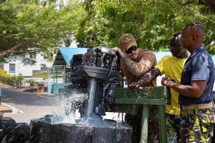 MOMBASA, Kenya (Jan. 24, 2023) Engineman 1st Class Michael Latek assists Kenyan sailors with small boat repairs during Central Partnership Station (CPS) in Mombasa, Kenya, Jan. 24. CPS is designed to strengthen regional relationships and collaboration between the U.S. Navy and Kenya Navy through professional exchanges and community engagement events.