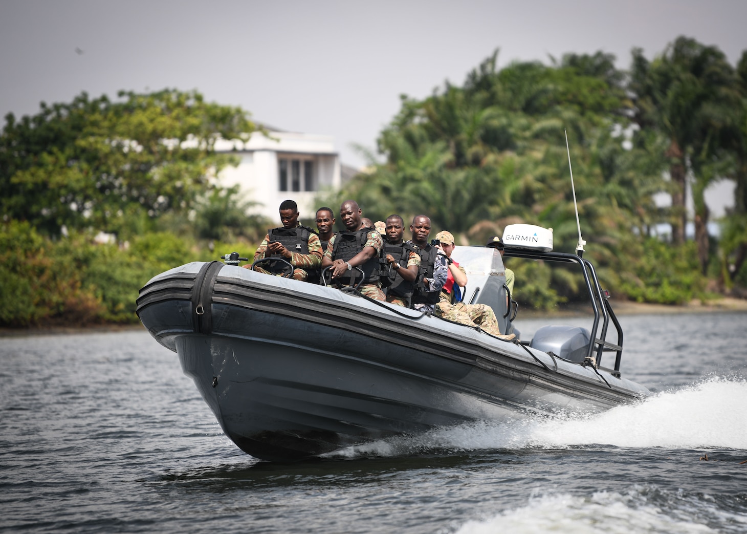 230125-N-DK722-1003 (Jan. 25, 2023) LAGOS, Nigeria – Benin Navy and Police Force personnel, alongside U.S. Coast Guard personnel from Law Enforcement Detachment 403, conduct Visit, Board, Search and Seizure training during Obangame Express 2023, in Lagos, Nigeria, Jan. 25, 2023. Obangame Express 2023, conducted by U.S. Naval Forces Africa, is a maritime exercise designed to improve cooperation, and increase maritime safety and security among participating nations in the Gulf of Guinea and Southern Atlantic Ocean. U.S. Sixth Fleet, headquartered in Naples, Italy, conducts the full spectrum of joint and naval operations, often in concert with allied and interagency partners, in order to advance U.S. national interests and security and stability in Europe and Africa. (U.S. Navy photo by Mass Communication Specialist 1st class Cameron C. Edy)