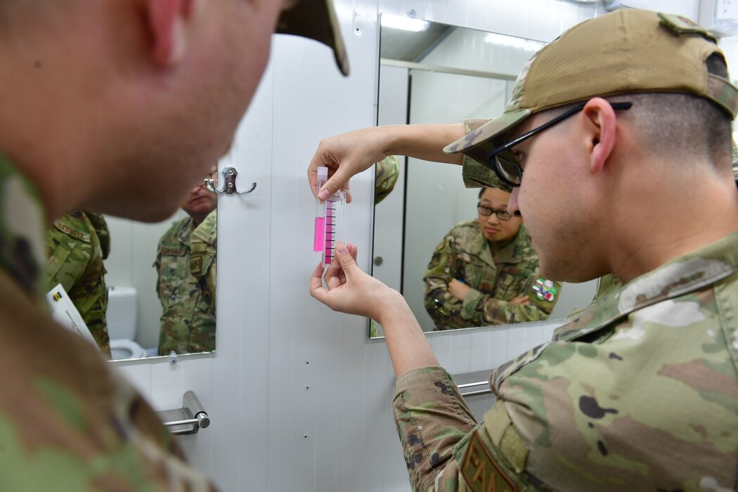 Staff Sgt. Kelsey Aldridge, 332d Expeditionary Medical Squadron independent duty medical technician, performs water quality testing at an undisclosed location in Southwest Asia, January 20, 2023