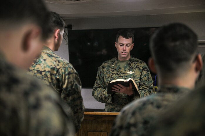 U.S. Navy Lt. Cmdr. Austin Grimes, a chaplain with 13th Marine Expeditionary Unit, leads a chapel service aboard the amphibious assault ship USS Makin Island (LHD 8), Jan. 22. The 13th MEU is embarked on the Makin Island Amphibious Ready Group, comprised of the Makin Island and amphibious transport dock ships USS John P. Murtha (LPD 26) and USS Anchorage (LPD 23), and operating in the U.S. 7th Fleet area of operations. 7th Fleet is the U.S. Navy's largest forward-deployed numbered fleet, and routinely interacts and operates with Allies and partners in preserving a free and open Indo-Pacific region.