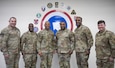 Maj. Gen. Michel M. Russell Sr., commanding general, 1st Theater Sustainment Command, Maj. Gen. David Wilson, commanding general, Army Sustainment Command, Maj. Gen. Gavin Lawrence, commanding general, Military Surface Deployment and Distribution Command, and their Command Sgts. Maj. stand for a group photo during a leader professional development conference at Camp Arifjan, Kuwait on Jan. 24, 2023.