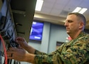 U.S. Marine Corps Gunnery Sgt. Bryan Jones, assigned to Joint Task Force Civil Support, assembles his workstation in a newly-renovated joint operations center, Nov. 23, 2022.