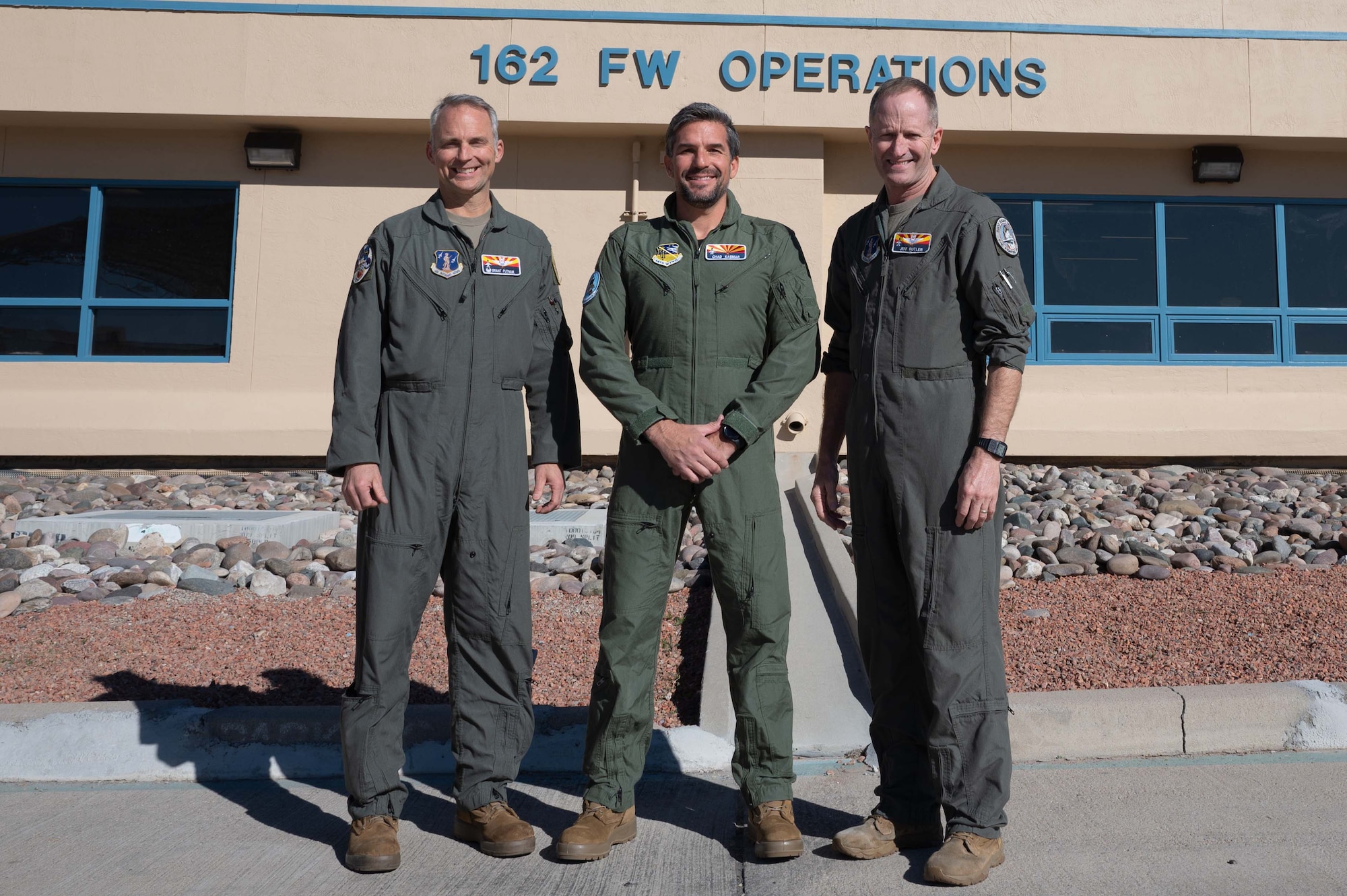 Col. Brant Putnam, the 162nd Wing Vice Commander, Chad Kasmar, Tucson Police Department Chief of Police, and Brig Gen. Jeffrey Butler, 162nd Wing Commander, gather outside the 162nd Wing Operations Group building before Chief Kasmar flew in an F-16 with Col. Putnam as his pilot. (U.S. Air Force photo by Maj. Angela Walz)