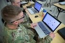 U.S. Army Sgt. 1st Class Gary Cato, assigned to Incident Support Team 1 logistics at Joint Task Force Civil Support, prepares table name tents as part of Exercise Sudden Response 23, at Camp Mabry, Texas, Dec. 8, 2022.