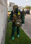 Lance Cpl. Anastasia Walker, a member of the hazardous materials response team assigned to the Marine Corps Chemical, Biological Incident Response Force, checks a simulated disaster recovery area for notional toxic industrial chemical contamination during Exercise Sudden Response 23 at Fort Hood, Texas Dec. 9, 2022.