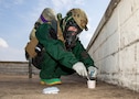 Lance Cpl. Anastasia Walker, a member of the hazardous materials response team assigned to the Marine Corps Chemical, Biological Incident Response Force, samples a notional toxic industrial chemical contaminate during Exercise Sudden Response 23 at Fort Hood, Texas Dec. 9, 2022.