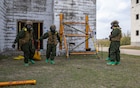 Marines assigned to the Marine Corps Chemical, Biological Incident Response Force rescue a simulated casualty while conducting search and rescue operations during Exercise Sudden Response 23 at Fort Hood, Texas Dec. 9, 2022.