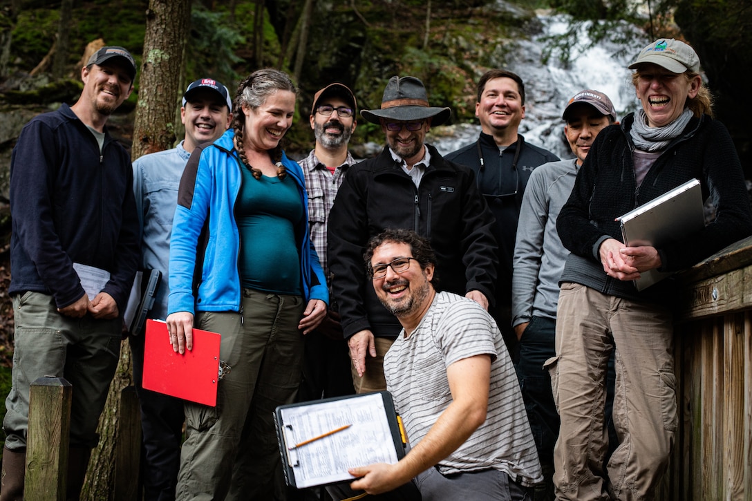 The National Technical Committee for Ordinary High Watermarks (OHWM), made up of researchers from the U.S. Army Engineer Research and Development Center’s (ERDC) Cold Regions Research and Engineering Laboratory (CRREL), the Environmental Protection Agency, regulators from the U.S. Army Corps of Engineers and other academic institutions, stand in front of a waterfall following a field test of an interim OHWM identification data sheet.